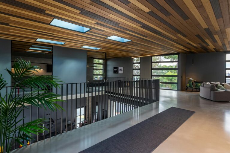 Stylish contemporary open-plan interior with wooden accents and natural light.